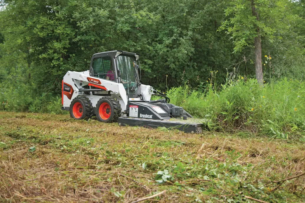 Bobcat S510 with brush cutter for forestry work
