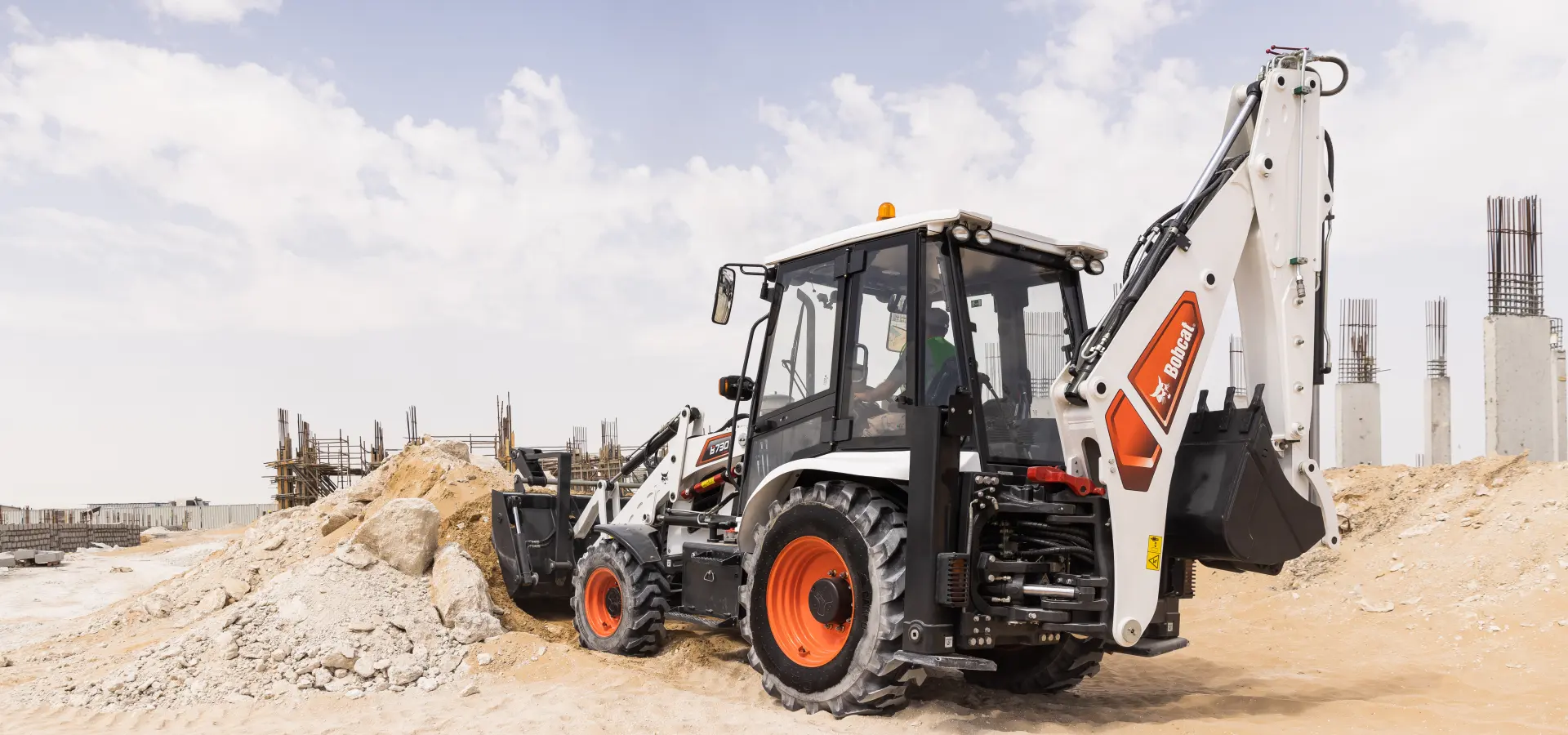 Bobcat B730M backhoe loader working on a construction site