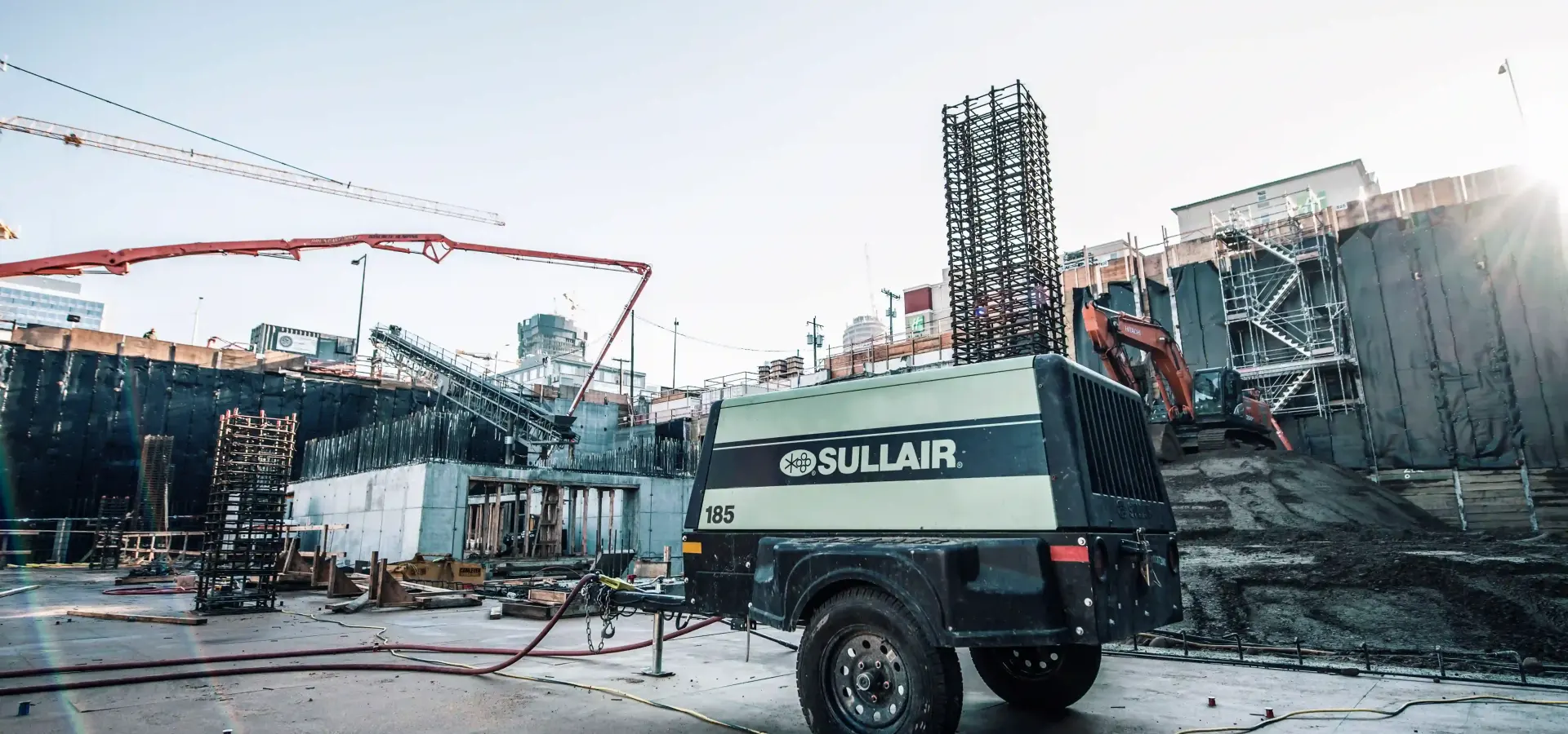 Sullair portable air compressor on a city construction site