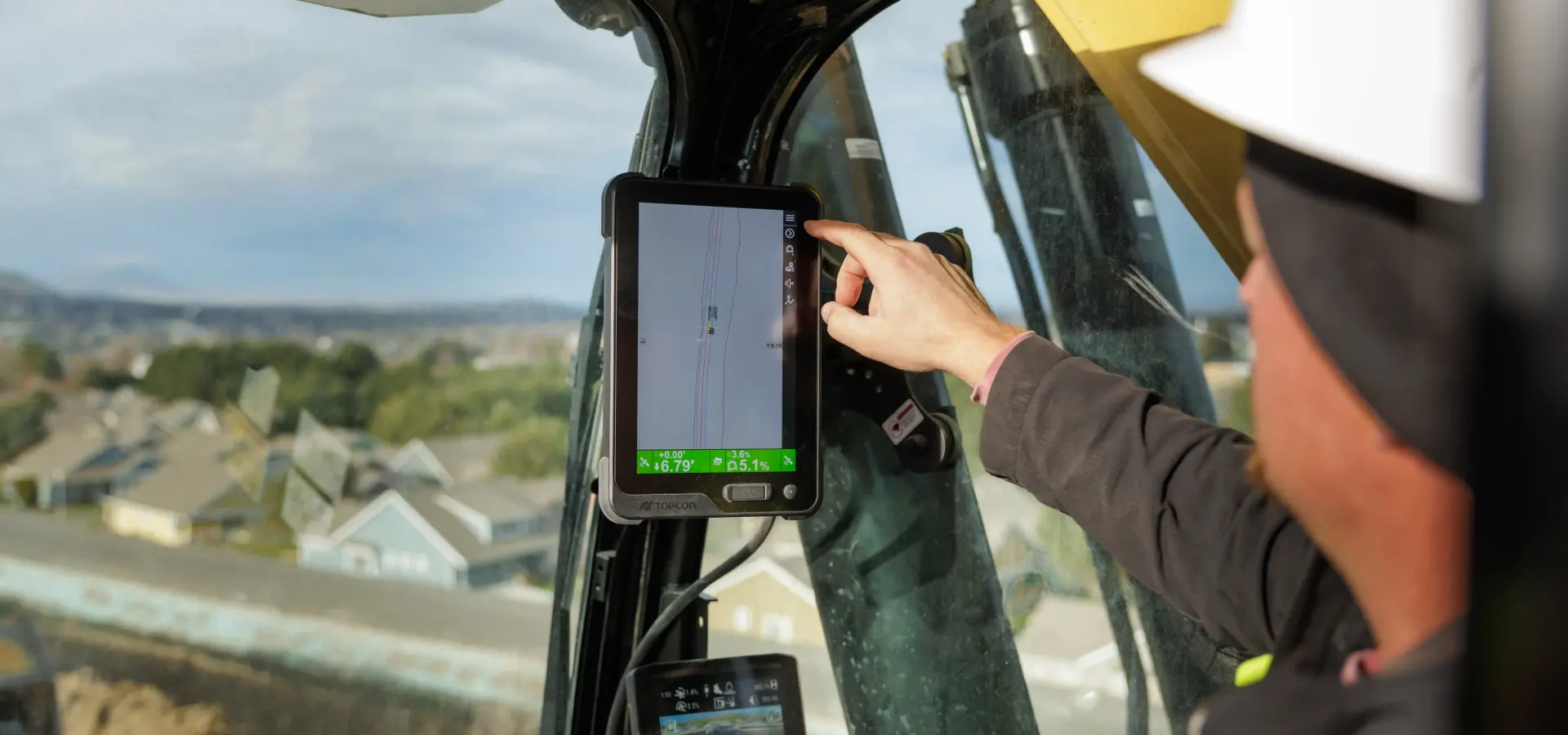 Topcon machine control display inside an excavator cab